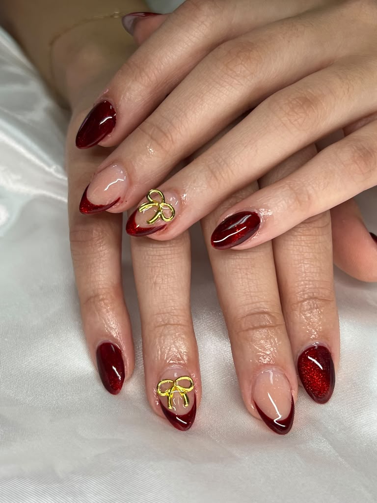 Glitter red nails with gold bows