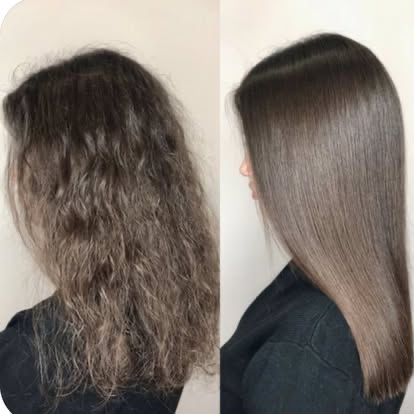 Wavy hair smoothed to a glossy finish